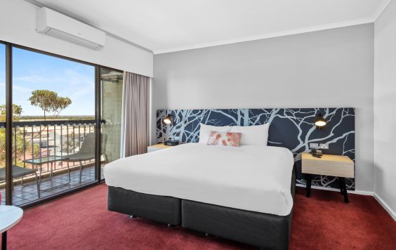 Queen bed at Plaza Hotel