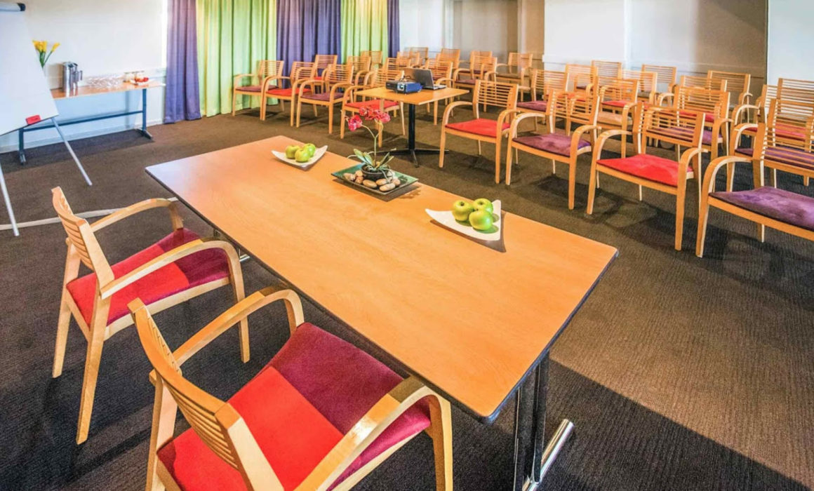 Chairs in function room and fruit on table