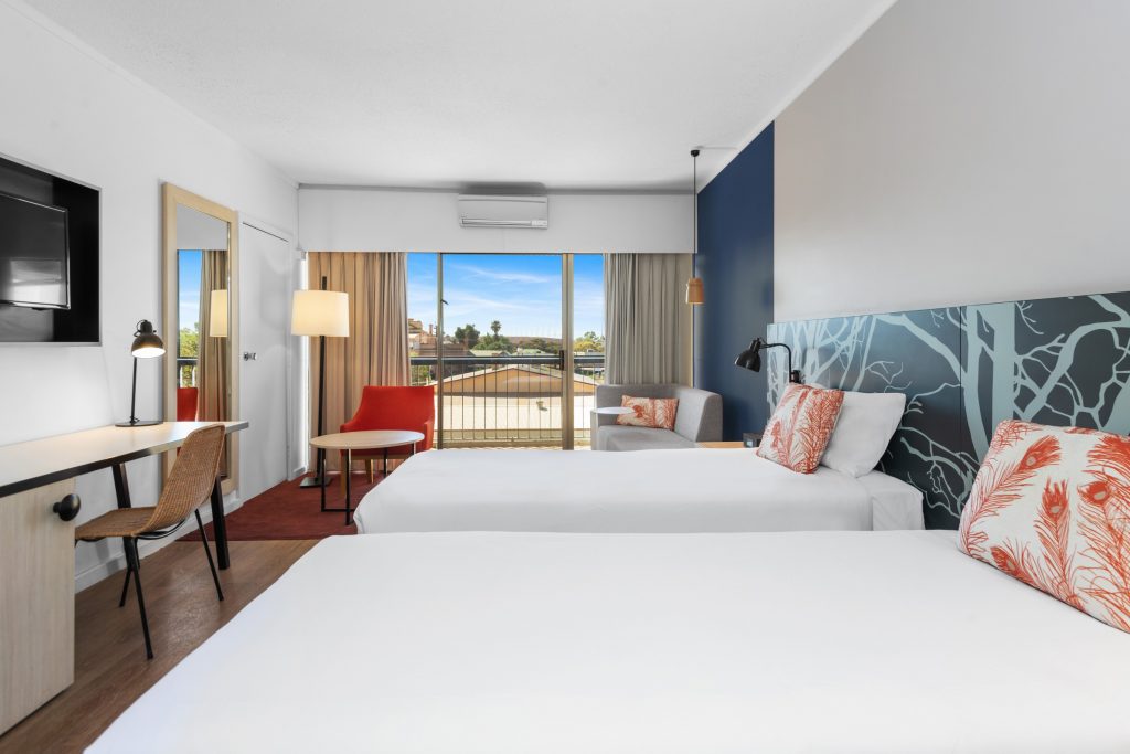 The executive twin room has two single beds, a flat-screen TV, balcony, and work desk