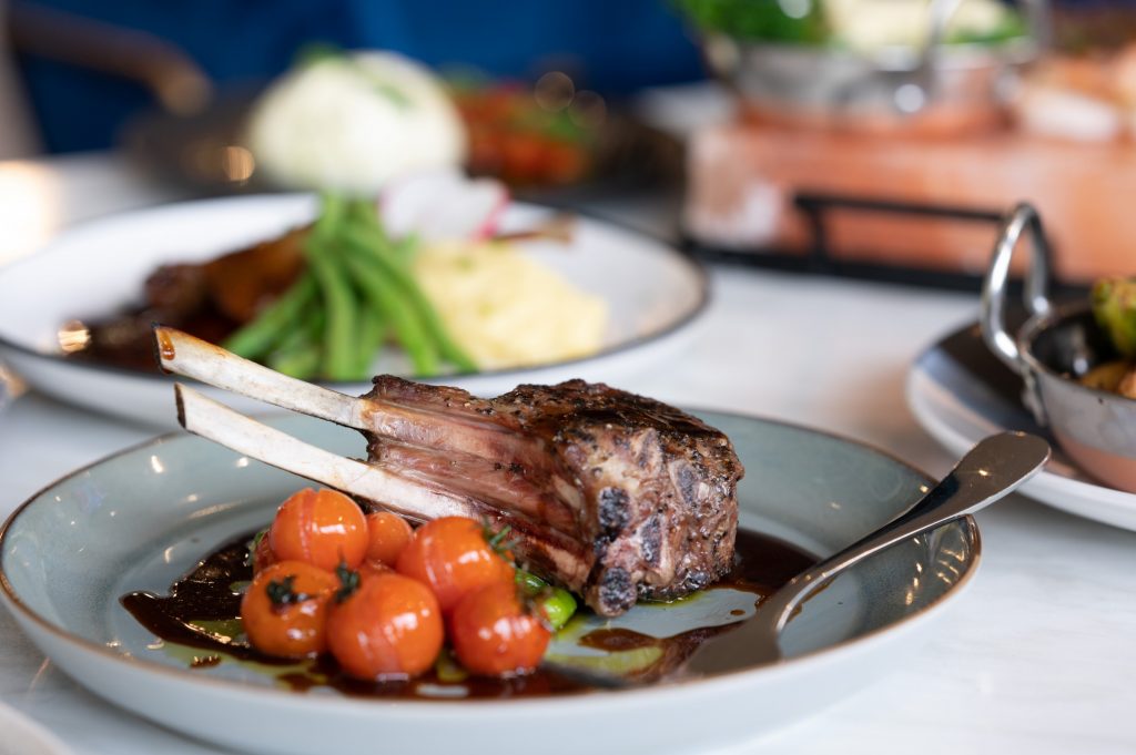 A roasted rack of lamb with blistered cherry tomatoes is served for dinner at the Kalgoorlie Plaza Hotel