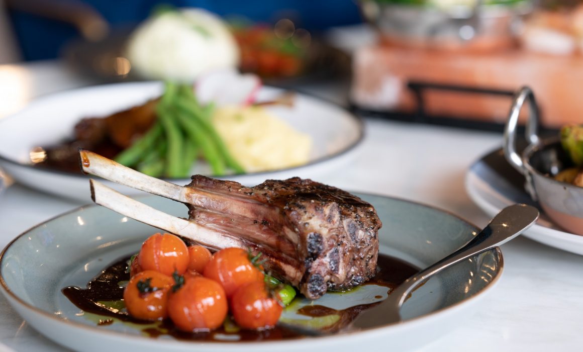 A roasted rack of lamb with blistered cherry tomatoes is served for dinner at the Kalgoorlie Plaza Hotel