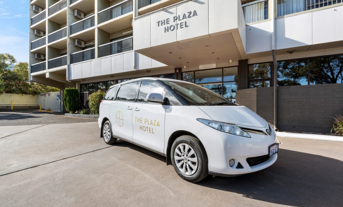 Plaza Hotel from the front, car with Plaza logo on it