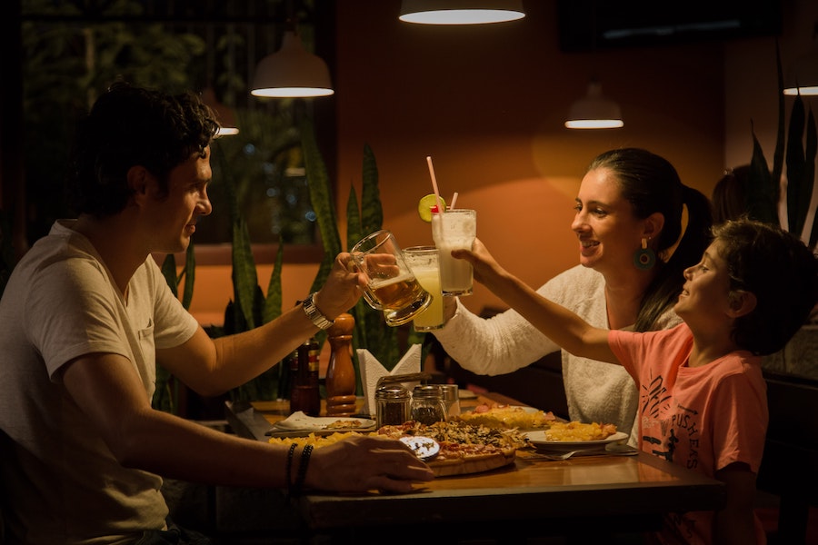 A family enjoys dinner in a restaurant