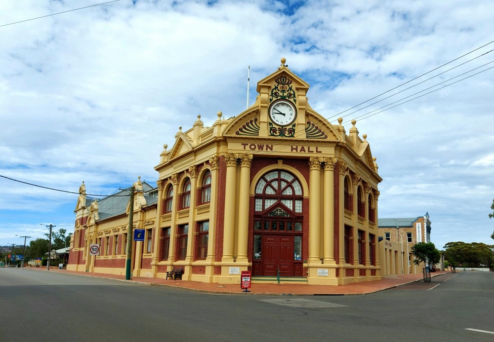 Street view of the historic York Town Hall, which is located on the corner of a main street.